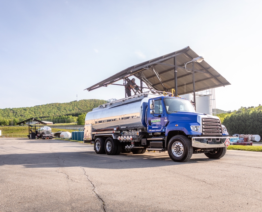 Hutchens Rentz-Eden tank truck filling up with diesel at fuel station