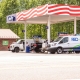 Liberty gasoline station with REO Service van parked at pump