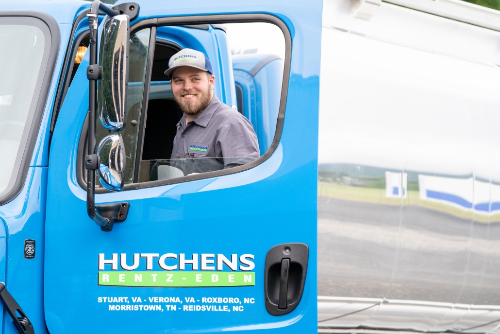 Hutchens Rentz-Eden employee entering a fuel delivery truck.