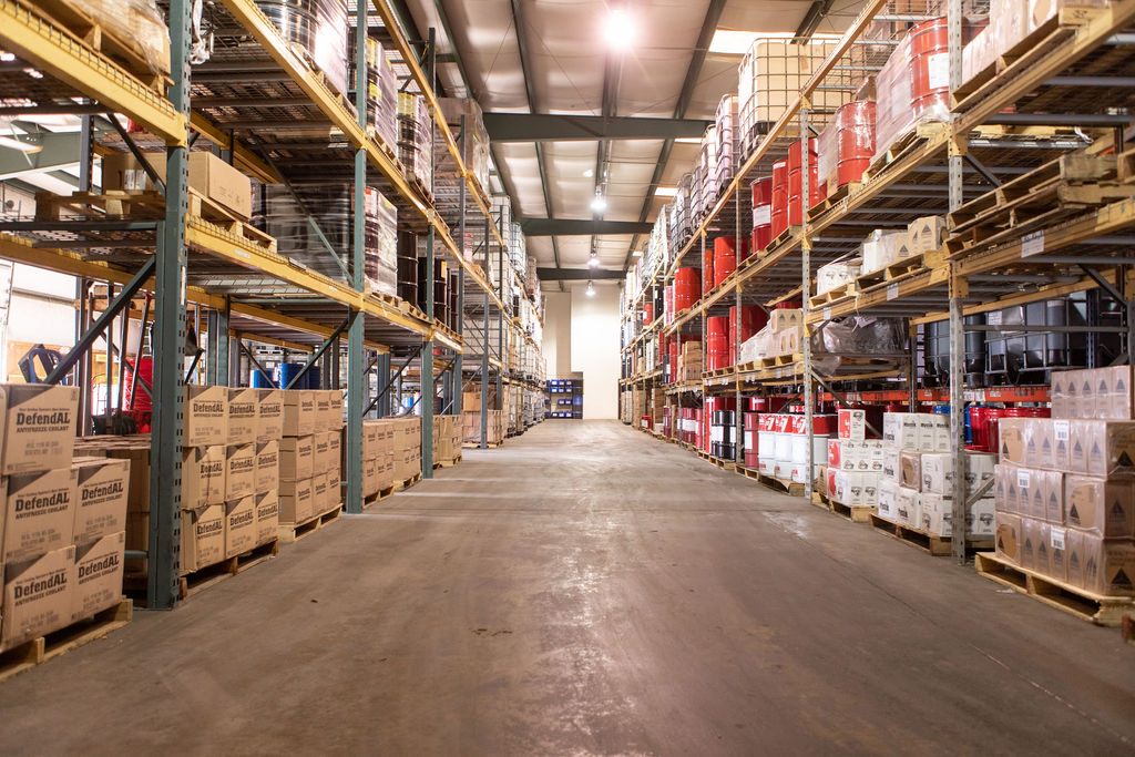 Warehouse with shelves stacked high with motor oil