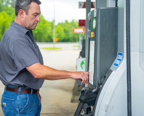 man at the gas pump